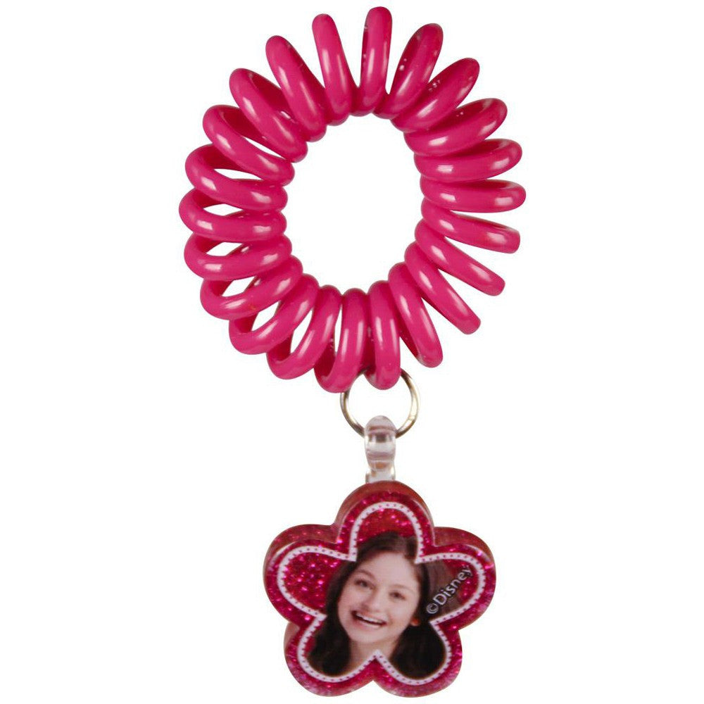 Hot pink spiral hair tie with flower-shaped photo charm on a clip loop