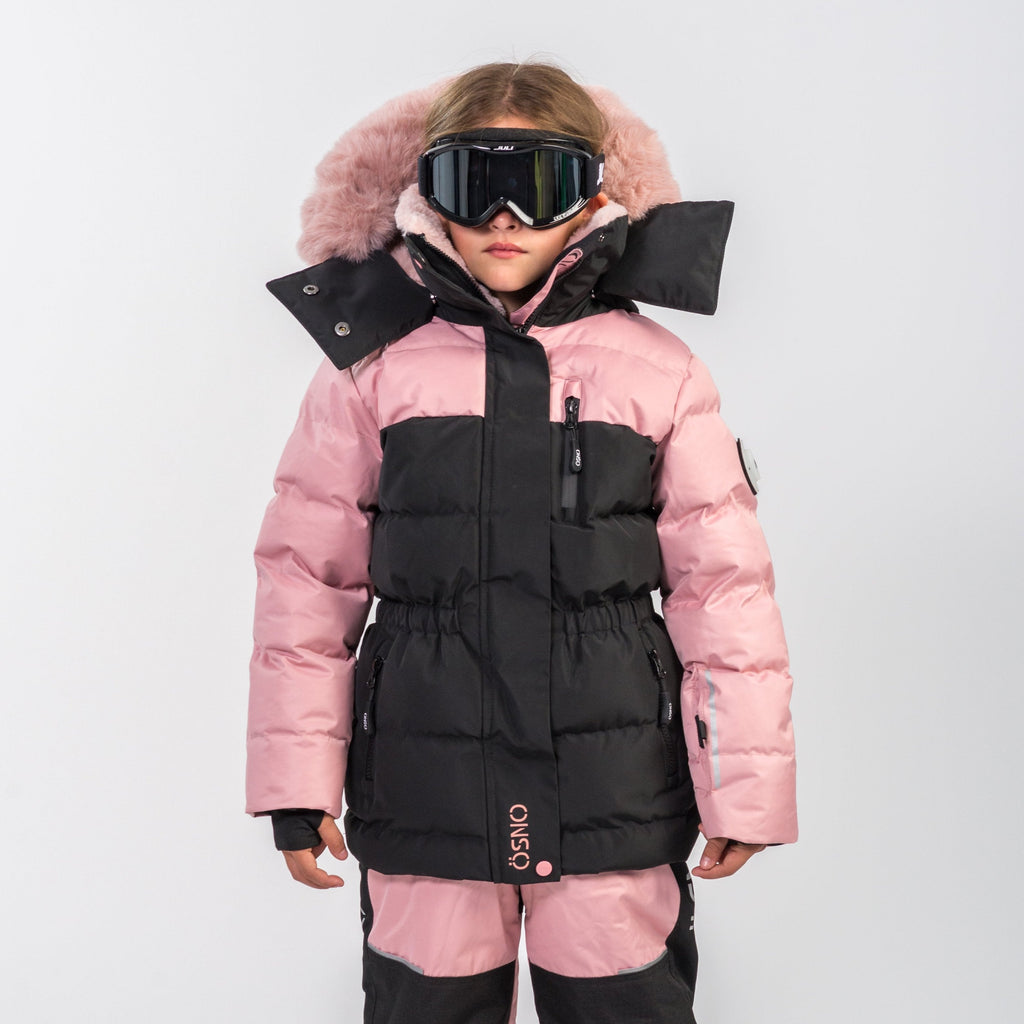 Kids blush and black snowsuit jacket with faux-fur trim, high collar, and goggles