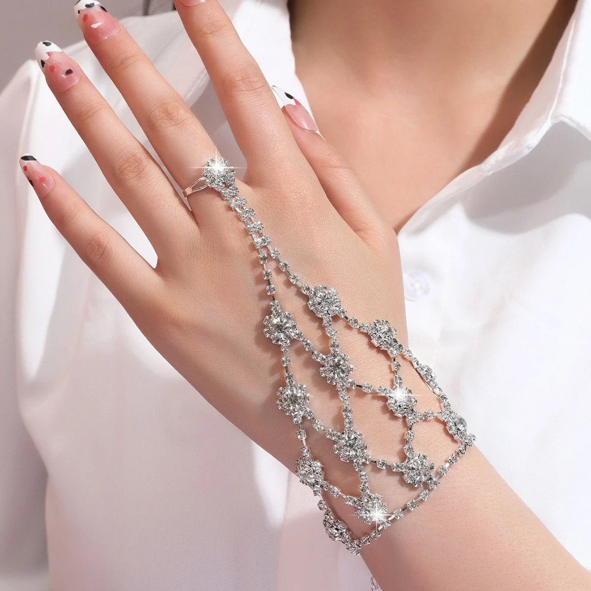 Rhinestone flower ring with matching bracelet connector, silver-toned chain and blooms