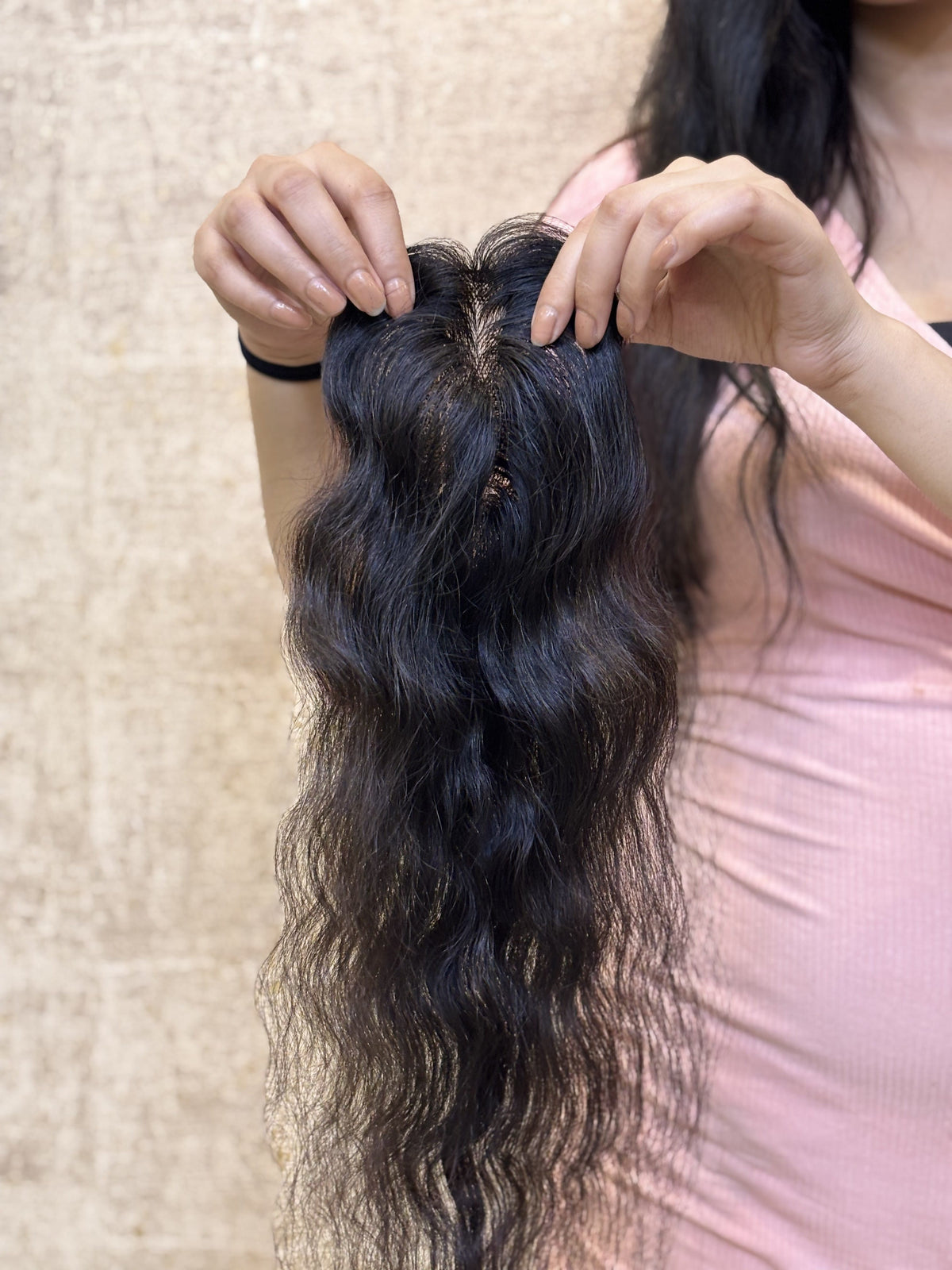 Natural black straight hair patch with long strands, shown from the top view.